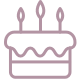 icon of a birthday cake with icing and 3 candles